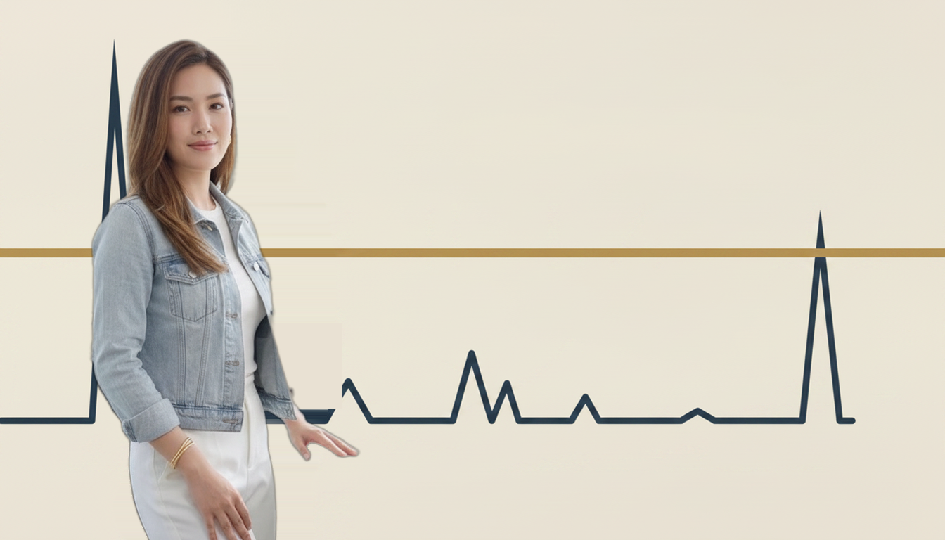 Cassia Fo, wearing her light denim jacket over a white top, standing beside two abstract rate lines on a plain warm ivory background: a flat gold line representing the unchanging HDB concessionary rate, and a jagged navy line representing the floating bank rate, with a tall spike on the left (the 1997-98 Asian Financial Crisis) and a smaller spike on the right (the 2022-23 SORA hike).
